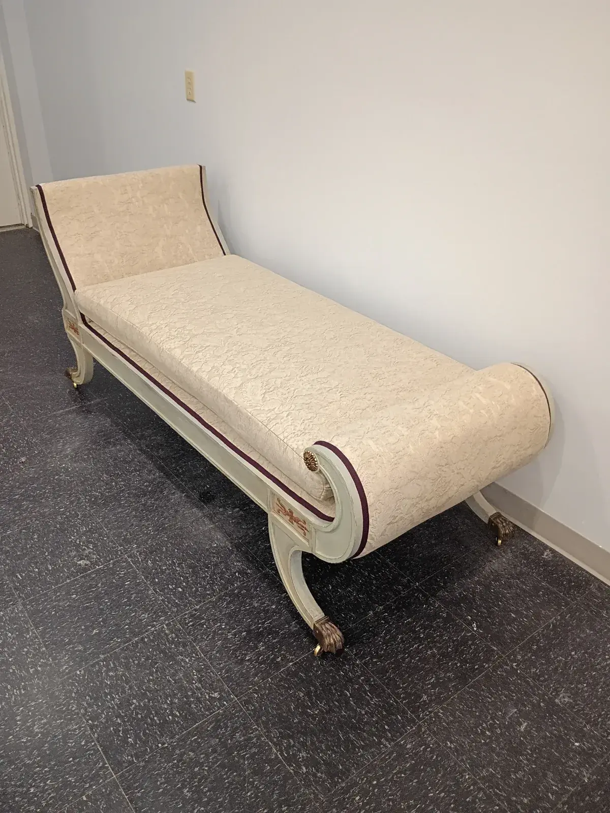 Grecian-style chaise with scroll ends reupholstered in pale gold fabric