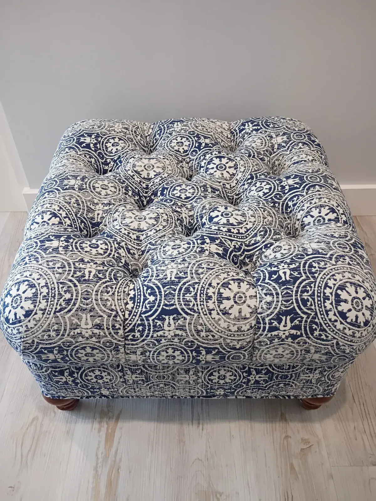 Button-tufted ottoman in blue and white medallion fabric